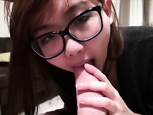 Harriet Sugarcookie indulges in solo play, spreading her legs wide, culminating in a messy facial.
